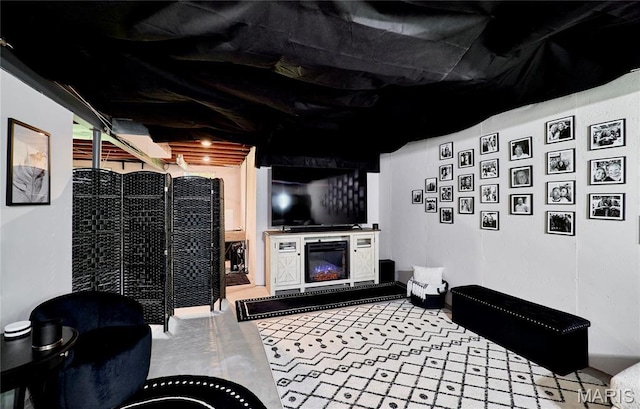 10 Warshire Ct Unit 67B, Ofallon, MO 63366 - living area with a glass covered fireplace