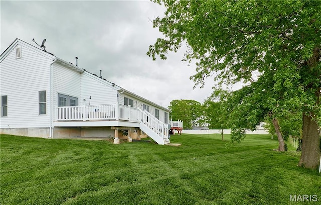 10 Warshire Ct Unit 67B, Ofallon, MO 63366 - back of property with a wooden deck and a yard