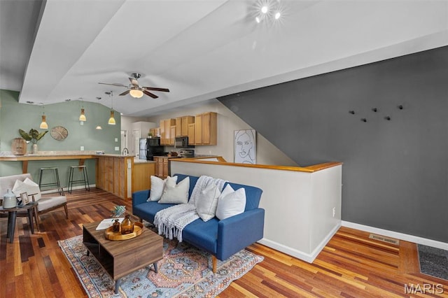 3318 Sidney St, Saint Louis, MO 63104 - living area featuring lofted ceiling, ceiling fan, wood finished floors, and baseboards