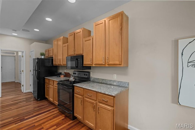 3318 Sidney St, Saint Louis, MO 63104 - kitchen with black appliances, baseboards, dark wood finished floors, recessed lighting, and light stone countertops