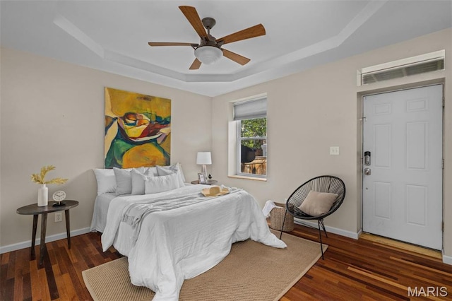 3318 Sidney St, Saint Louis, MO 63104 - bedroom featuring a raised ceiling, wood finished floors, and baseboards