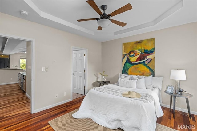 3318 Sidney St, Saint Louis, MO 63104 - bedroom featuring a raised ceiling, wood finished floors, baseboards, and a ceiling fan