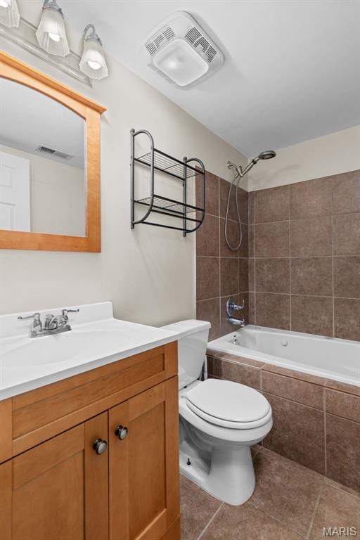 3318 Sidney St, Saint Louis, MO 63104 - full bathroom featuring tile patterned flooring, toilet, tiled shower / bath combo, and vanity