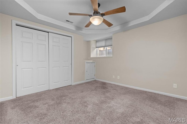 3318 Sidney St, Saint Louis, MO 63104 - unfurnished bedroom featuring a raised ceiling, carpet floors, a closet, and baseboards