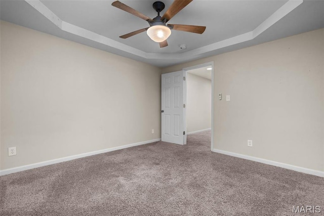 3318 Sidney St, Saint Louis, MO 63104 - carpeted spare room featuring a ceiling fan, a raised ceiling, baseboards, and a smoke detector