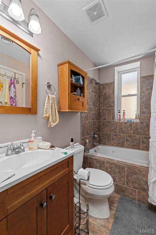 3318 Sidney St, Saint Louis, MO 63104 - bathroom featuring tile patterned flooring, toilet, tiled shower / bath combo, and vanity
