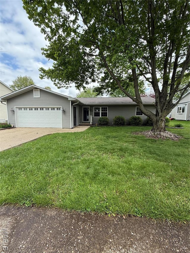 710 Ash St, Greenville, IL 62246 - ranch-style home with an attached garage, concrete driveway, and a front lawn