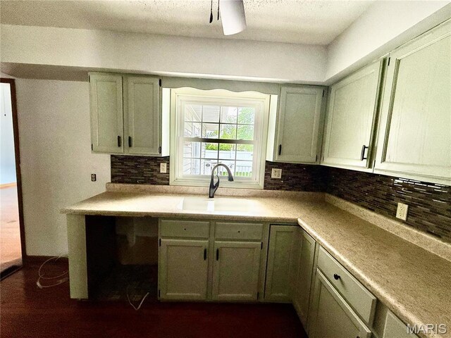 710 Ash St, Greenville, IL 62246 - kitchen featuring a sink, tasteful backsplash, and light countertops