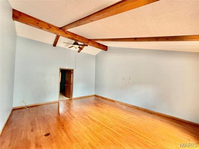 710 Ash St, Greenville, IL 62246 - empty room featuring ceiling fan, light wood-style floors, baseboards, and a textured ceiling