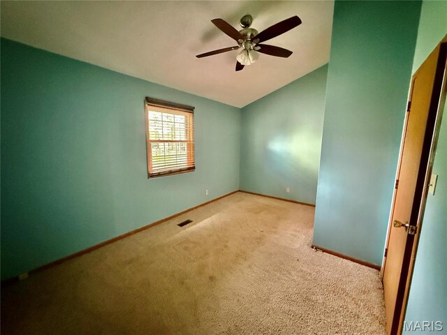 710 Ash St, Greenville, IL 62246 - spare room with carpet flooring, a ceiling fan, baseboards, and lofted ceiling