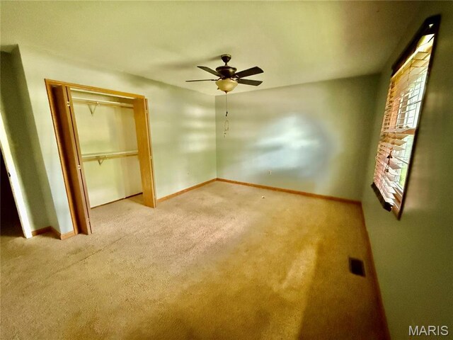 710 Ash St, Greenville, IL 62246 - unfurnished bedroom featuring carpet floors, baseboards, and ceiling fan
