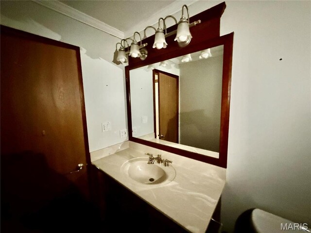 710 Ash St, Greenville, IL 62246 - bathroom with ornamental molding, toilet, and vanity