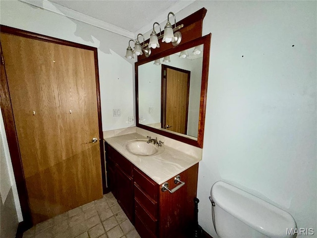 710 Ash St, Greenville, IL 62246 - half bath featuring ornamental molding, vanity, and toilet