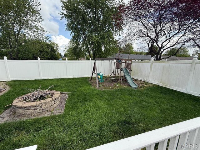 710 Ash St, Greenville, IL 62246 - view of yard featuring an outdoor fire pit and a playground