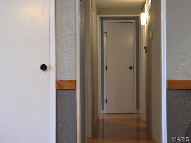 306 Edna Ln, Sparta, IL 62286 - hall featuring a textured wall, wood finished floors, and baseboards