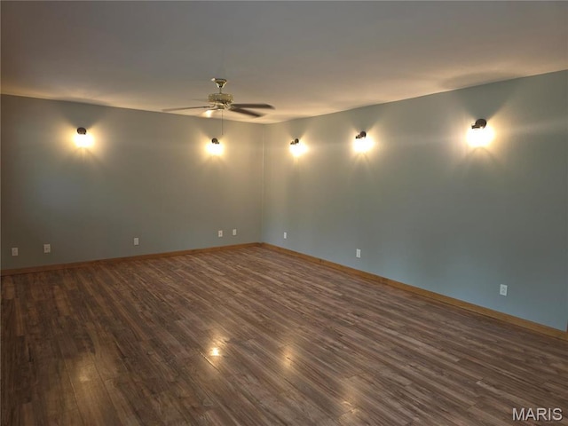306 Edna Ln, Sparta, IL 62286 - empty room with dark wood-style floors, ceiling fan, and baseboards