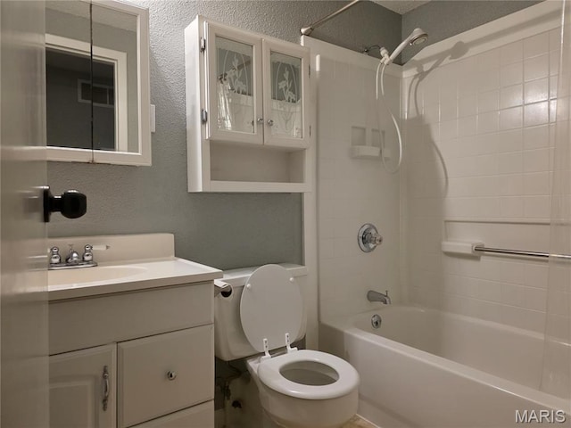 306 Edna Ln, Sparta, IL 62286 - full bathroom with toilet, vanity, bathtub / shower combination, and a textured wall