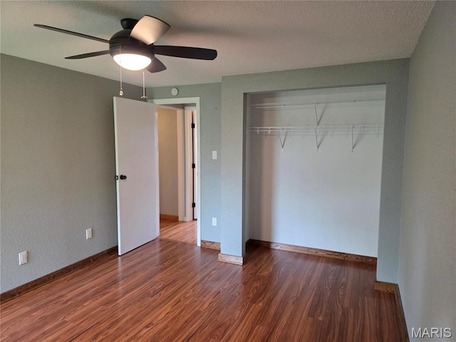306 Edna Ln, Sparta, IL 62286 - unfurnished bedroom with wood finished floors, a closet, baseboards, and ceiling fan