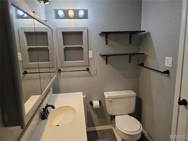 306 Edna Ln, Sparta, IL 62286 - bathroom with toilet, baseboards, and vanity