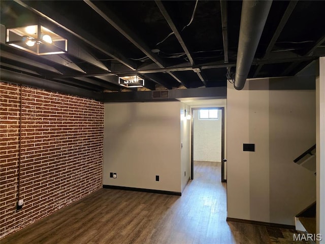 306 Edna Ln, Sparta, IL 62286 - basement with brick wall, wood finished floors, and baseboards