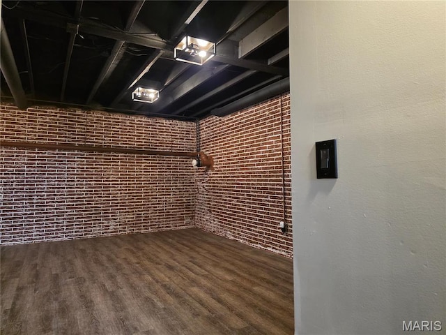 306 Edna Ln, Sparta, IL 62286 - basement with wood finished floors and brick wall