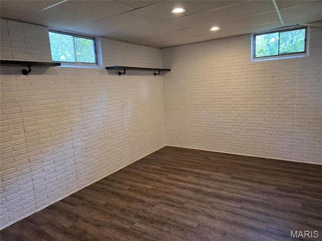306 Edna Ln, Sparta, IL 62286 - basement with brick wall, dark wood-type flooring, a paneled ceiling, and recessed lighting