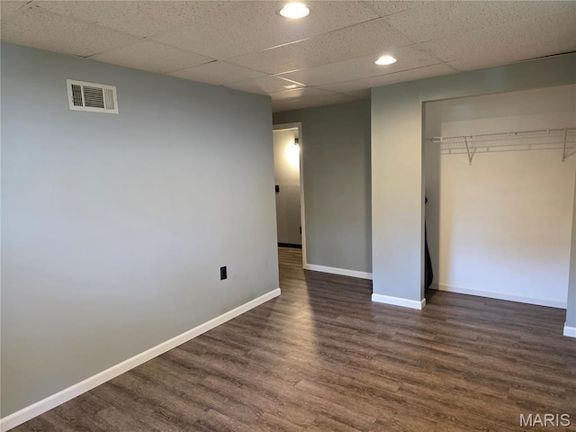 306 Edna Ln, Sparta, IL 62286 - unfurnished bedroom featuring dark wood finished floors, baseboards, recessed lighting, a closet, and a drop ceiling