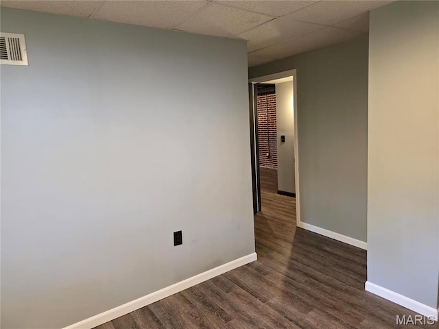 306 Edna Ln, Sparta, IL 62286 - unfurnished room with baseboards, wood finished floors, and a paneled ceiling
