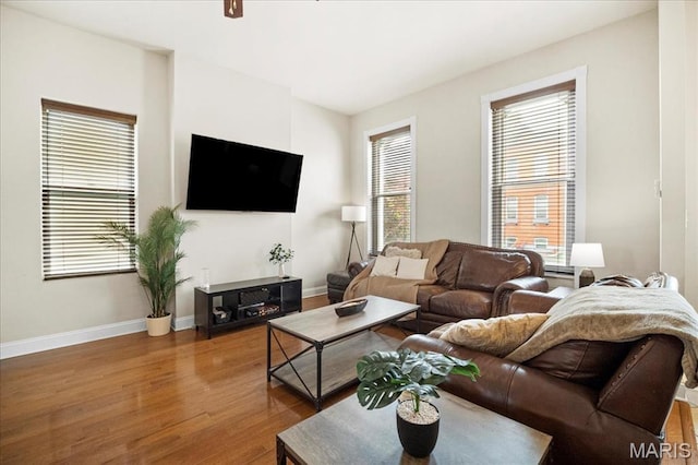 living room with wood finished floors and baseboards