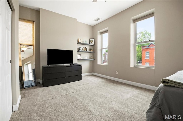 carpeted bedroom with baseboards