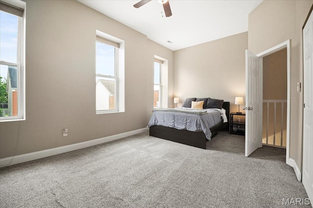 bedroom featuring carpet flooring, baseboards, and ceiling fan