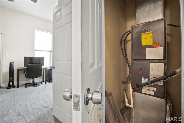 utility room with heating unit