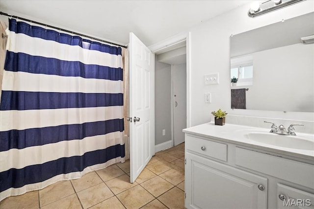 full bathroom featuring tile patterned flooring, vanity, and curtained shower