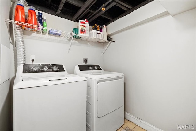 washroom with washer and dryer