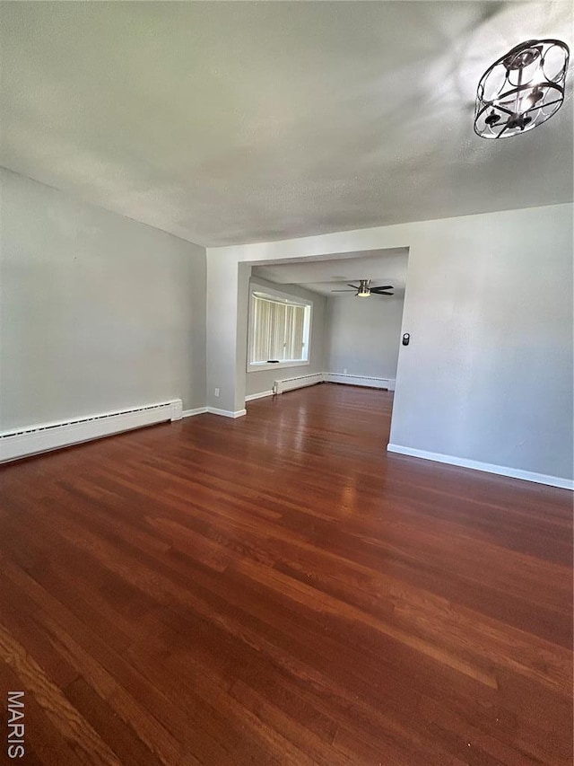 3604 Ridgedale Ave, Saint Louis, MO 63121 - spare room with wood finished floors, a baseboard radiator, baseboards, and ceiling fan