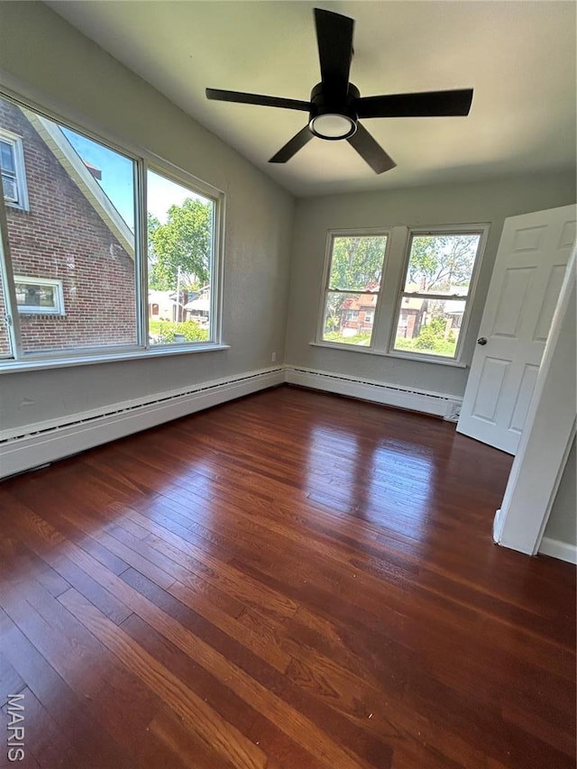 3604 Ridgedale Ave, Saint Louis, MO 63121 - empty room featuring wood-type flooring, a baseboard radiator, baseboards, a ceiling fan, and a baseboard heating unit