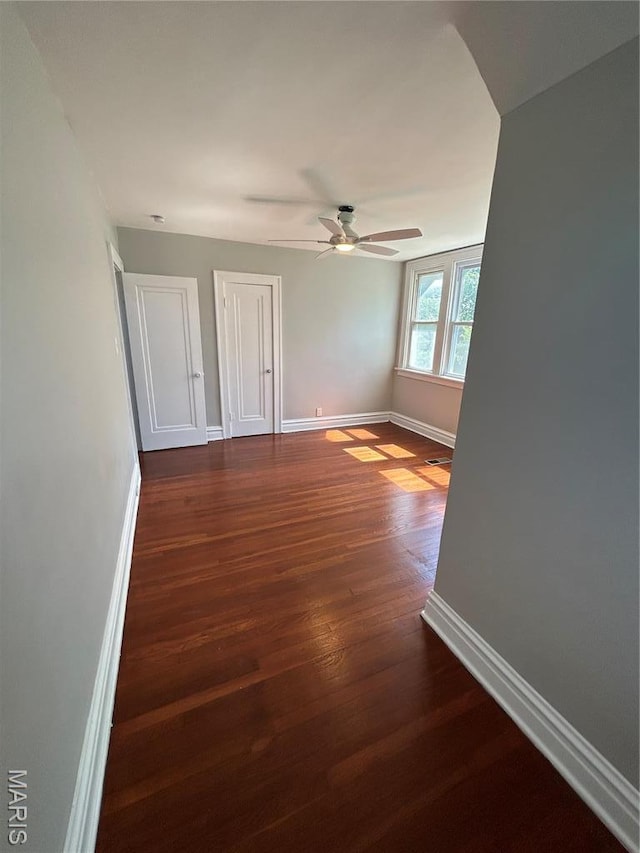 3604 Ridgedale Ave, Saint Louis, MO 63121 - spare room with baseboards, dark wood-style floors, and ceiling fan