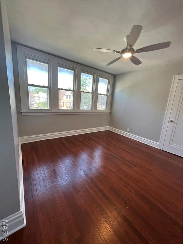 3604 Ridgedale Ave, Saint Louis, MO 63121 - spare room with dark wood finished floors, baseboards, and a ceiling fan