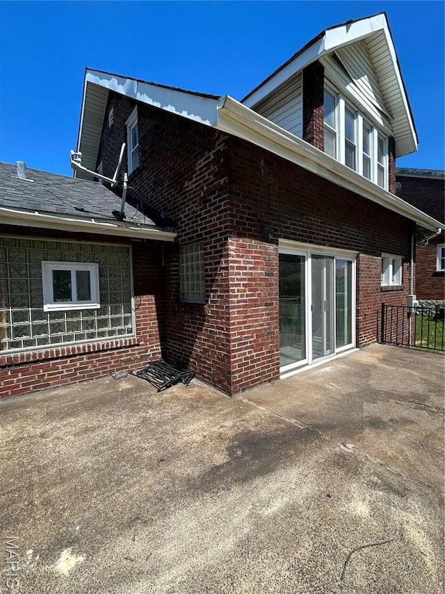 3604 Ridgedale Ave, Saint Louis, MO 63121 - view of side of property with brick siding and a patio