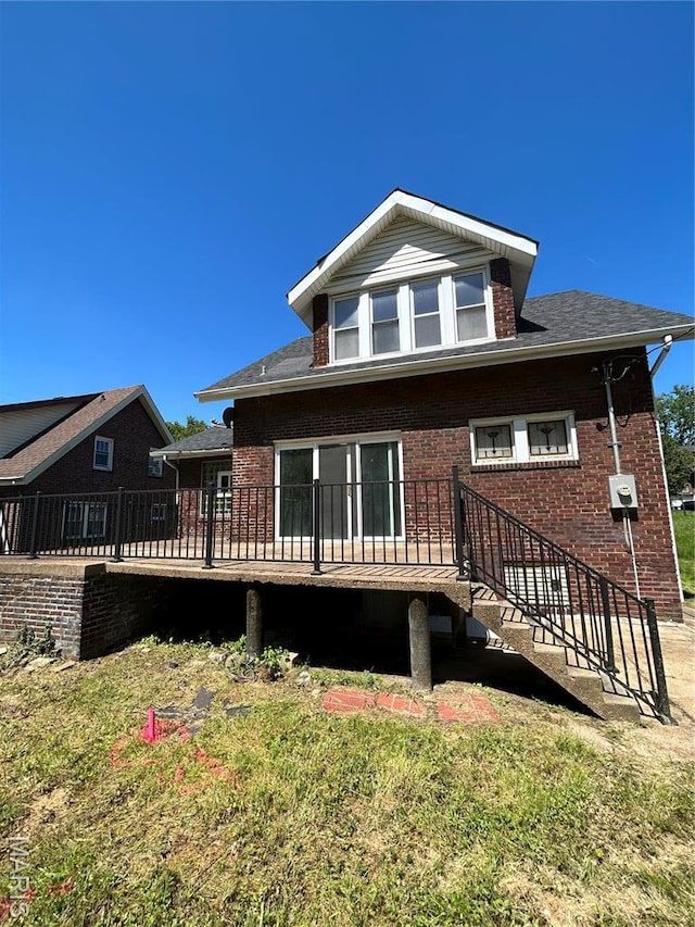 3604 Ridgedale Ave, Saint Louis, MO 63121 - view of front of house featuring brick siding and a wooden deck