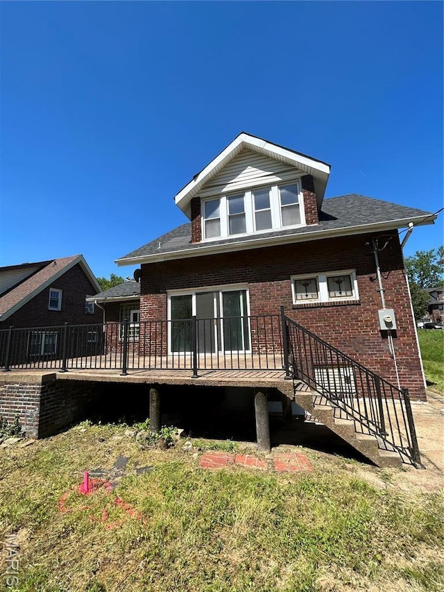 3604 Ridgedale Ave, Saint Louis, MO 63121 - back of property featuring a wooden deck and brick siding