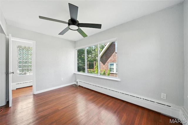 3604 Ridgedale Ave, Saint Louis, MO 63121 - empty room featuring a baseboard radiator, plenty of natural light, and wood finished floors