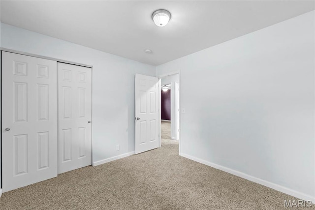 210 Scenic Dr, Elsberry, MO 63343 - unfurnished bedroom with carpet flooring, baseboards, and a closet