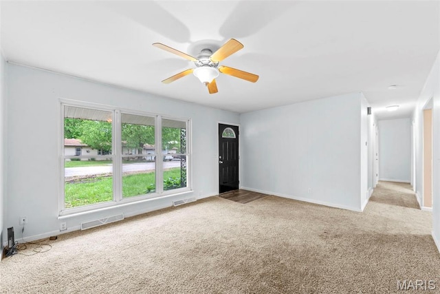 210 Scenic Dr, Elsberry, MO 63343 - unfurnished living room with carpet flooring, a ceiling fan, and baseboards