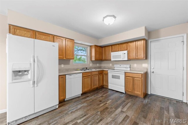 210 Scenic Dr, Elsberry, MO 63343 - kitchen with white appliances, a sink, light countertops, dark wood-type flooring, and brown cabinets