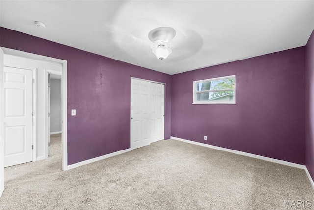 210 Scenic Dr, Elsberry, MO 63343 - unfurnished bedroom featuring carpet flooring, baseboards, and a closet