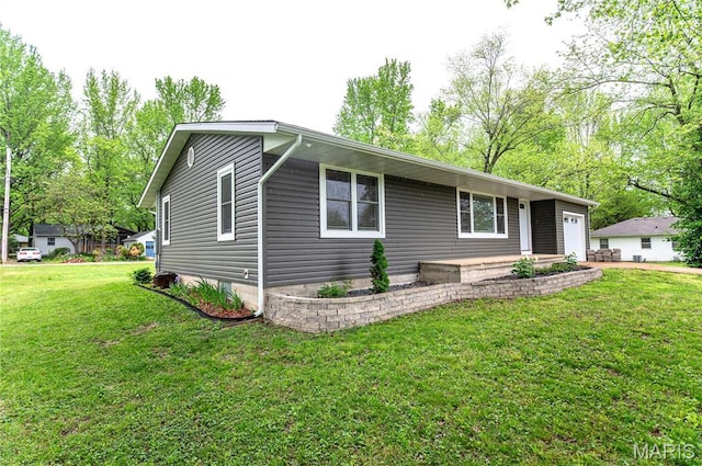 415 W James Blvd, St James, MO 65559 - view of front of home with a front lawn and an attached garage