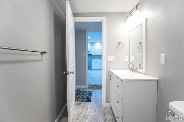 415 W James Blvd, St James, MO 65559 - half bathroom with vanity, toilet, and baseboards