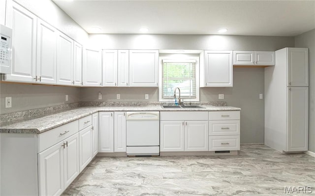 415 W James Blvd, St James, MO 65559 - kitchen featuring white dishwasher, a sink, white cabinets, light countertops, and recessed lighting