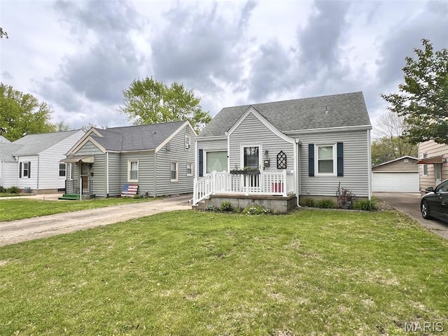 1816 N 22nd St, Springfield, IL 62702 - bungalow-style home with a front yard, an outbuilding, and a shingled roof